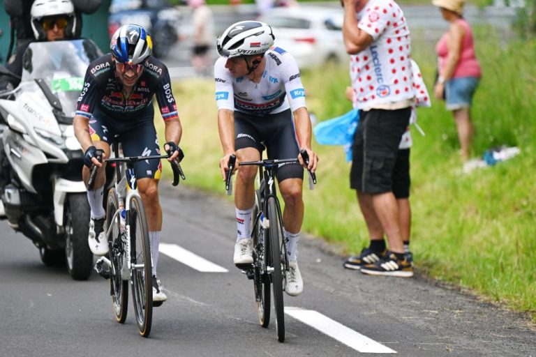LE-LIORAN, FRANCE - JULY 10: (L-R) Primoz Roglic of Slovenia and Team Red Bull &ndash; BORA &ndash; hansgrohe and Remco Evenepoel of Belgium and Team Soudal Quick-Step - White best young jersey compete during the 111th Tour de France 2024, Stage 11 a 211km stage from Evaux-les-Bains to Le Lioran (1239m) / #UCIWT / on July 10, 2024 in Le Lioran, France. (Photo by Tim de Waele/Getty Images)