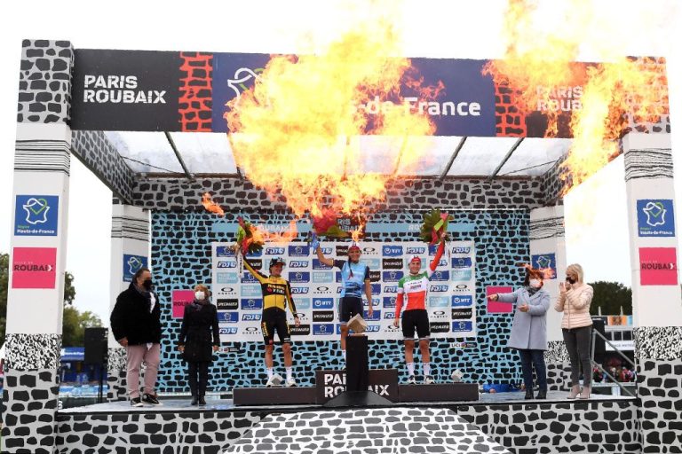 ROUBAIX, FRANCE - OCTOBER 02: (L-R) Marianne Vos of Netherlands and Jumbo Visma Team on second place, stage winner Elisabeth Deignan-Armitstead of United Kingdom and Team Trek - Segafredo and Elisa Longo Borghini of Italy and Team Trek - Segafredo on third place, pose with trophies on the podium during the podium ceremony after the 1st Paris-Roubaix 2021 - Women's Elite a 116,4km race from Denain to Roubaix / #ParisRoubaixFemmes / #ParisRoubaix / on October 02, 2021 in Roubaix, France. (Photo by Tim de Waele/Getty Images)